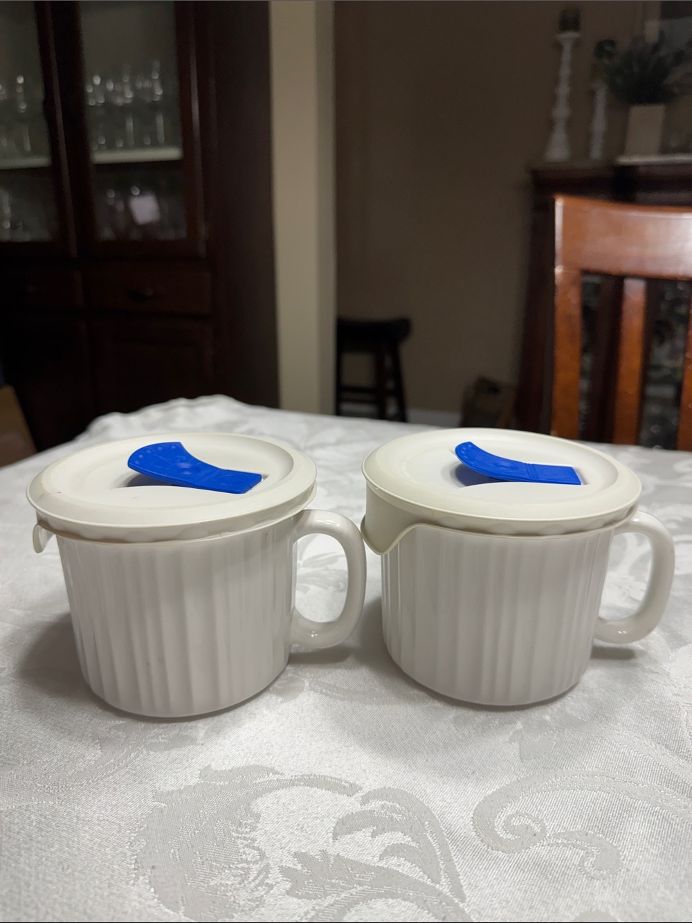 (2) Corning ware French White 20oz. Stoneware mugs w/ vented lids.
